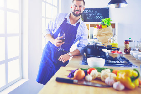 Portrait of handsome man filming cooking show or blogの写真素材