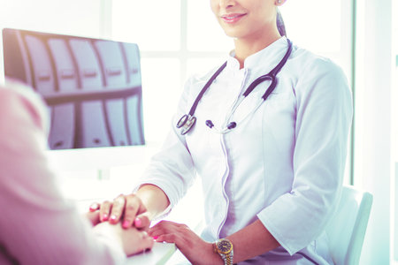 Healthcare and medical concept - doctor with patient in hospitalの写真素材