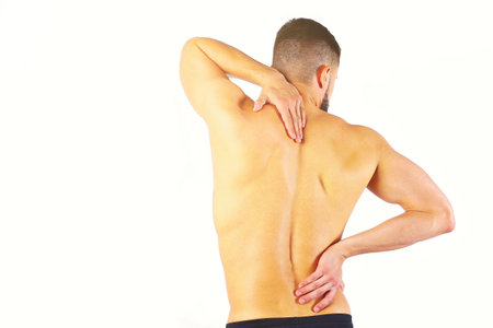 Young man holding his neck in pain. Medical conceptの写真素材
