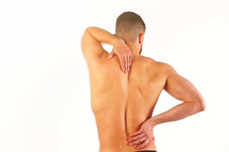 Young man holding his neck in pain. Medical conceptの写真素材