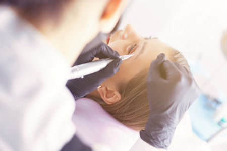 Microblading eyebrows work flow in a beauty salon.の写真素材
