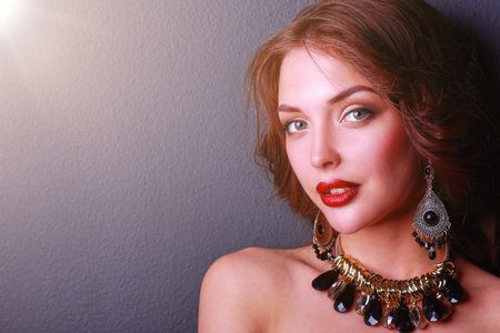 Beautiful woman with evening make-up in black dressの写真素材