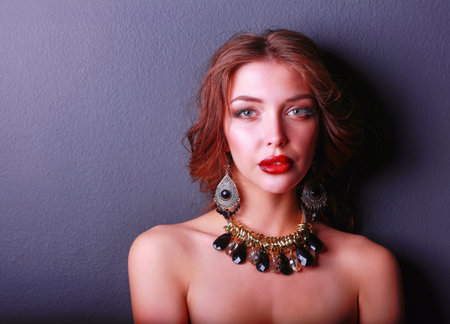 Beautiful woman with evening make-up in black dressの写真素材