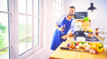 Portrait of handsome man filming cooking show or blogの写真素材