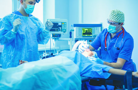Man surgeon at work in operating roomの写真素材