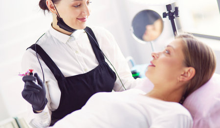 Microblading eyebrows work flow in a beauty salon.の写真素材