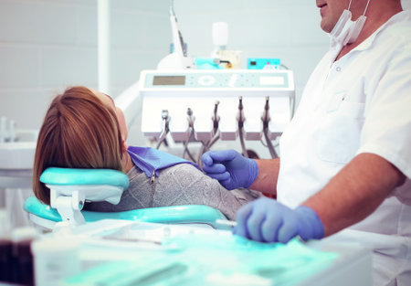 Doctor and patient in the dental clinicの写真素材