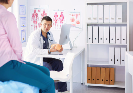 The patient and his doctor in medical officeの写真素材