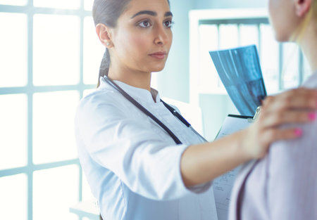 Healthcare and medical concept - doctor with patient in hospitalの写真素材
