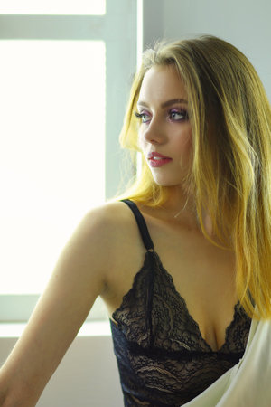 portrait sexy fashionable woman on the bedの写真素材