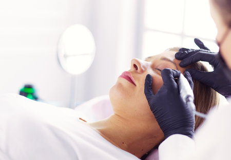 Microblading eyebrows work flow in a beauty salon.の写真素材