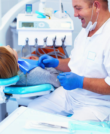Doctor and patient in the dental clinicの写真素材