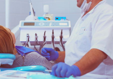 Doctor and patient in the dental clinicの写真素材