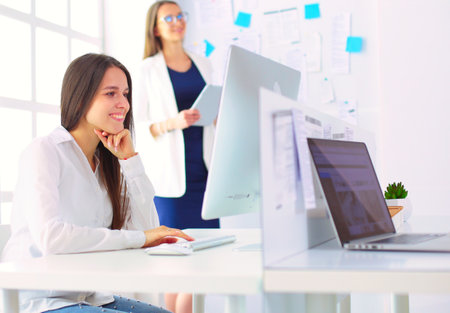 Attractive business woman working on laptop at office. Business peopleの写真素材