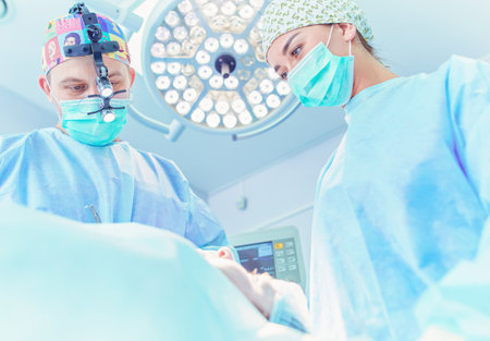 Man surgeon at work in operating roomの写真素材