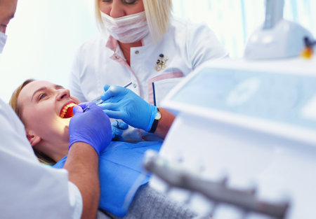 Doctor and patient in the dental clinicの写真素材