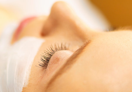 Spa facial mask application. Spa beauty organic facial mask application at day spa salon.の写真素材