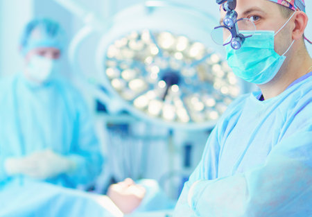 Male surgeon on background in operation roomの写真素材