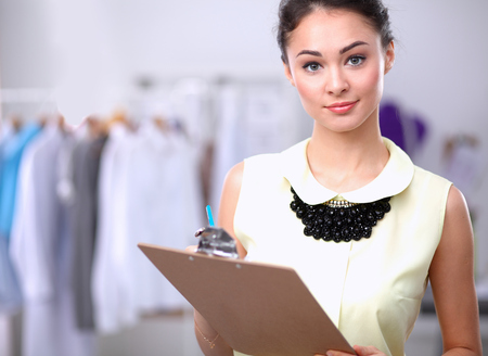 Modern young fashion designer working at studioの写真素材