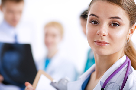 Woman doctor standing with stethoscope at hospital .の写真素材