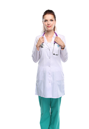 Portrait of young woman doctor with white coat standingの写真素材