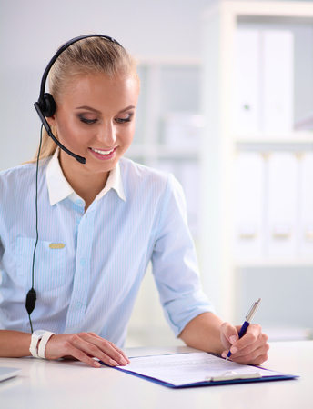 portrait of a customer service agent sitting at officeの写真素材