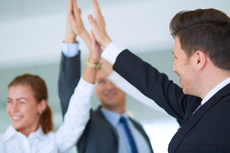 Business people with their hands together in a circle .の写真素材