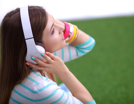 Young woman listening to the music .の写真素材