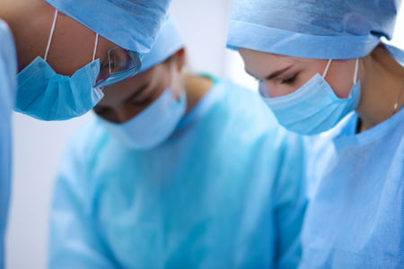 Team surgeon at work in operating roomの写真素材