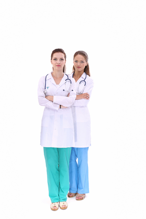 Two young woman doctor , standing in hospital .の写真素材