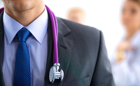 Male doctor in front of medical groupの写真素材