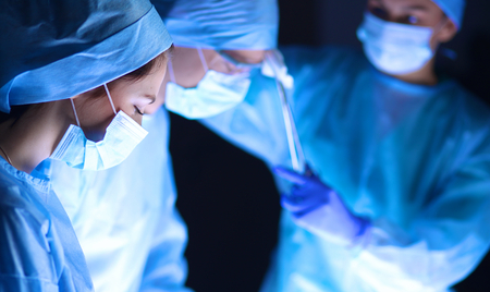 Team surgeon at work in operating roomの写真素材
