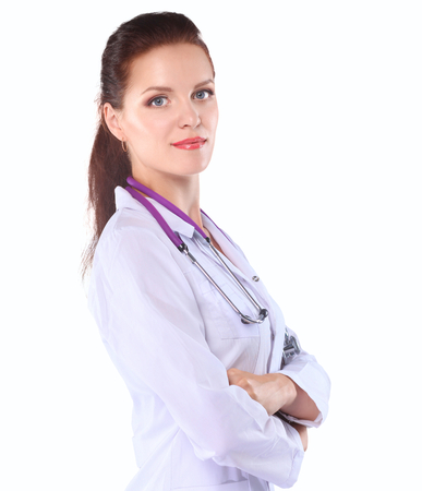 Portrait of young woman doctor with white coat standing in hospital .の写真素材