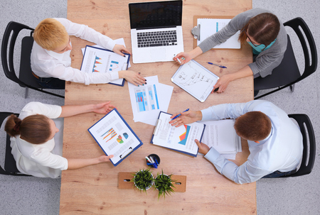 Business people sitting and discussing at business meetingの写真素材