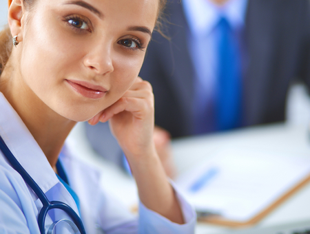 Medical team sitting at the table in modern hospital .の写真素材