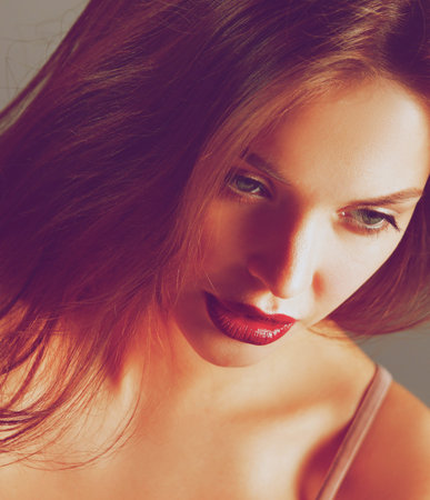 Portrait of beautiful woman , isolated on gray background.
