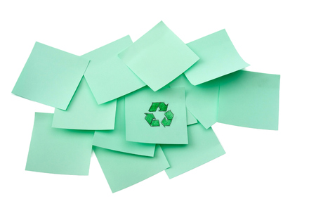 Recycle sign on green sheet of paper.の写真素材