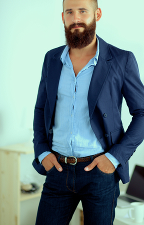 Portrait of handsome man isolated on grey backgroundの写真素材