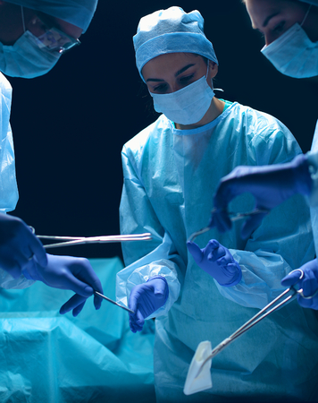 Team surgeon at work in operating room.の写真素材