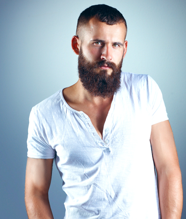 Portrait of handsome man standing, isolated on grey background.の写真素材