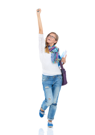 Portrait of young student woman holding exercise books.の写真素材