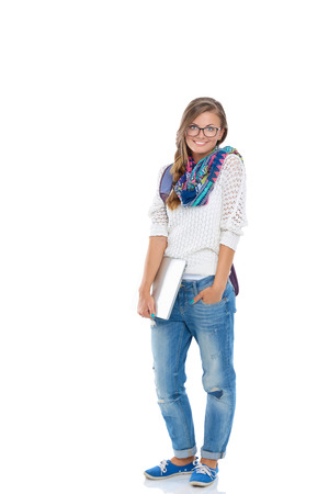 Portrait of young student woman holding exercise books.の写真素材