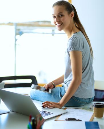 Portrait of student girl working on laptopの写真素材