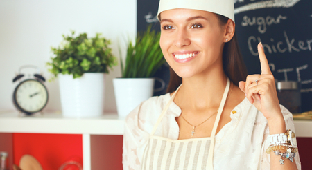 Chef woman portrait with  uniform in the kitchen .の写真素材
