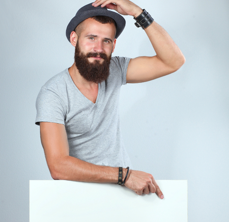 Portrait of young man standing in hat near blankの写真素材