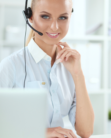 portrait of a customer service agent sitting at officeの写真素材