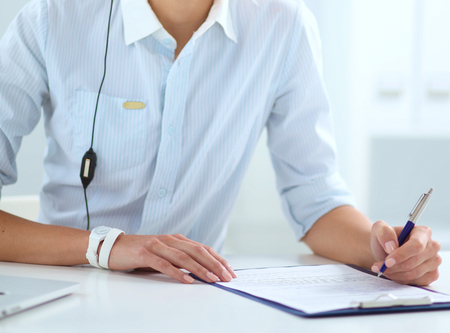 portrait of a customer service agent sitting at officeの写真素材