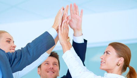 Business people with their hands together in a circle .の写真素材