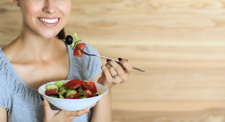 A beautiful girl eating healthy foodの写真素材