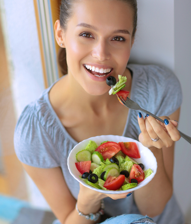 A beautiful girl eating healthy foodの写真素材